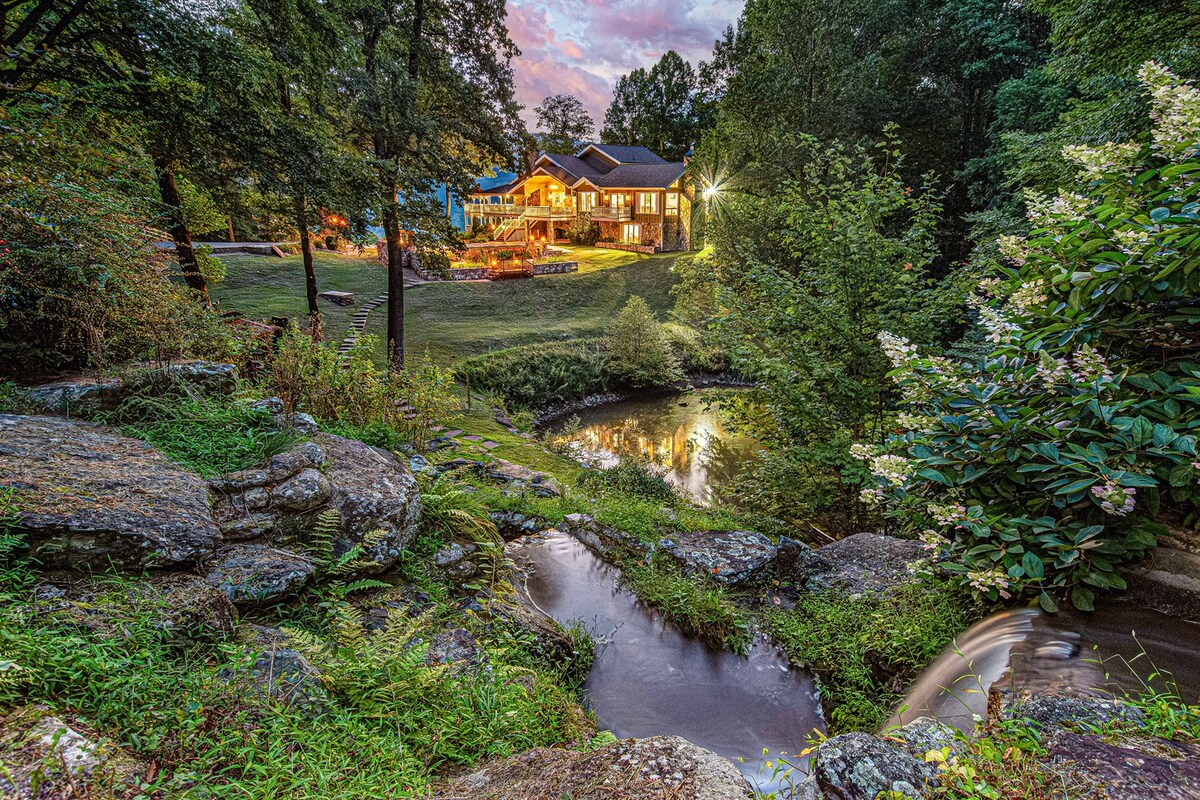 Hemingway Estates luxury mountain home with private waterfall and koi pond surrounded by forest