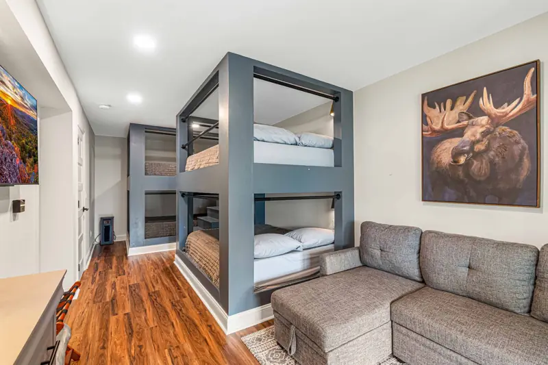 Lower-level bunk room — four queens