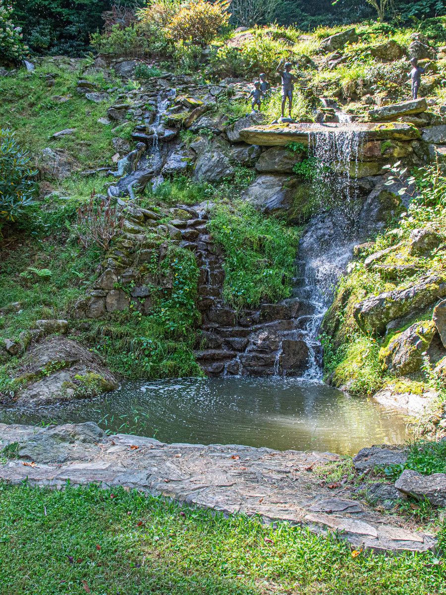 The private 85-ft waterfall and koi pond at Hemingway Estates